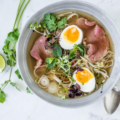 Pho Bo (beef and noodle soup) with micro greens